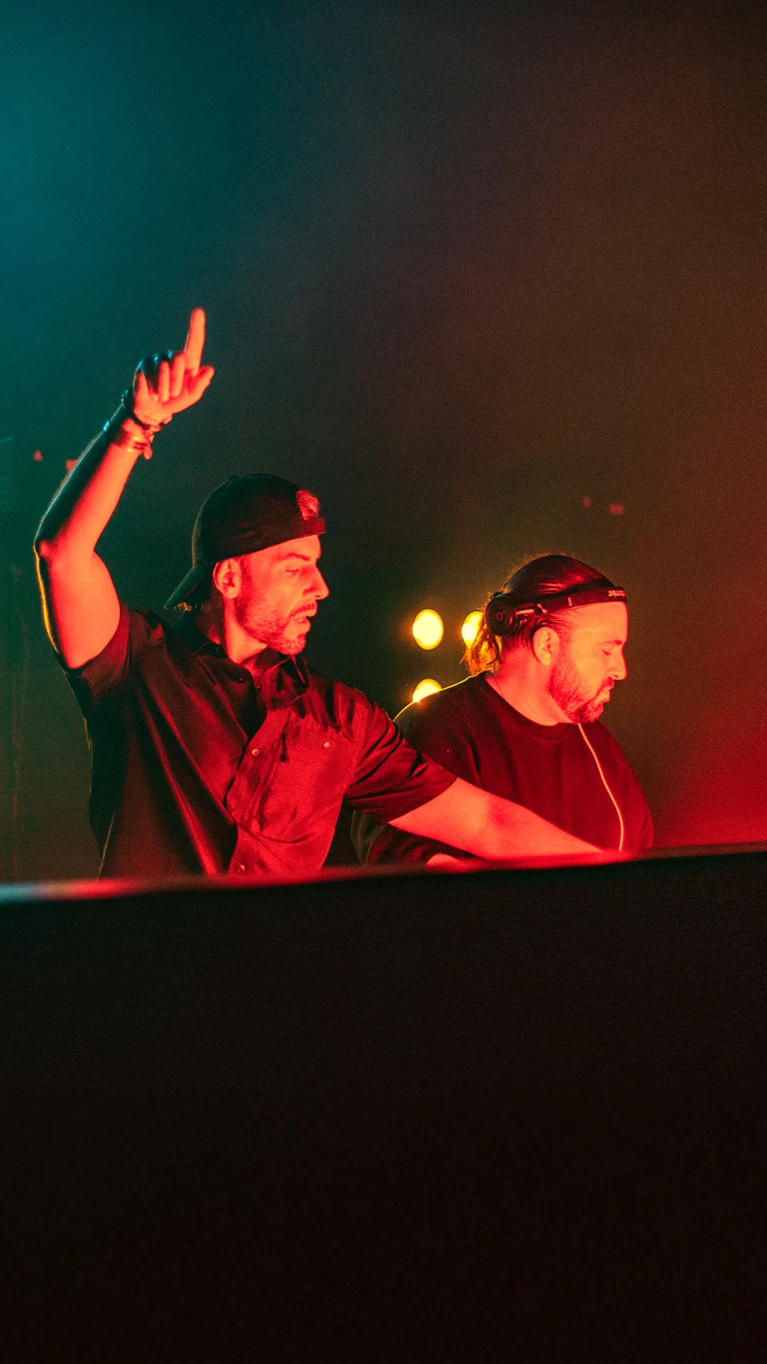 Still Young behind the decks in red light